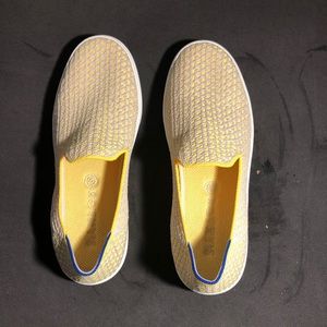 White and yellow Rothy’s The sneaker